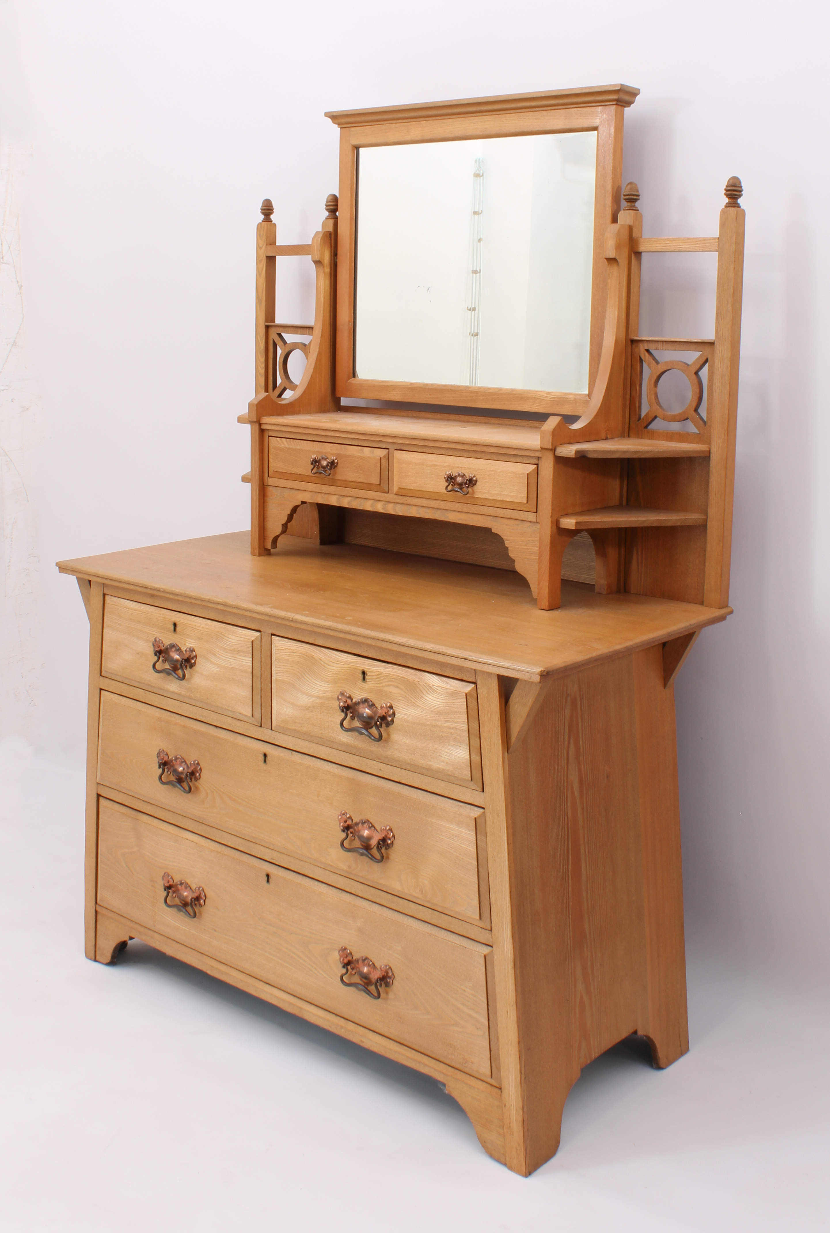 An Arts & Crafts ash dressing table - early 20th century, the top with a rectangular mirror over two