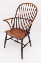 An early 19th century yew wood, beech and elm hoop back Windsor arm chair - the yew wood hoop back