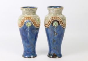 A pair of Royal Doulton stoneware baluster vases - impressed factory marks and incised decorator's