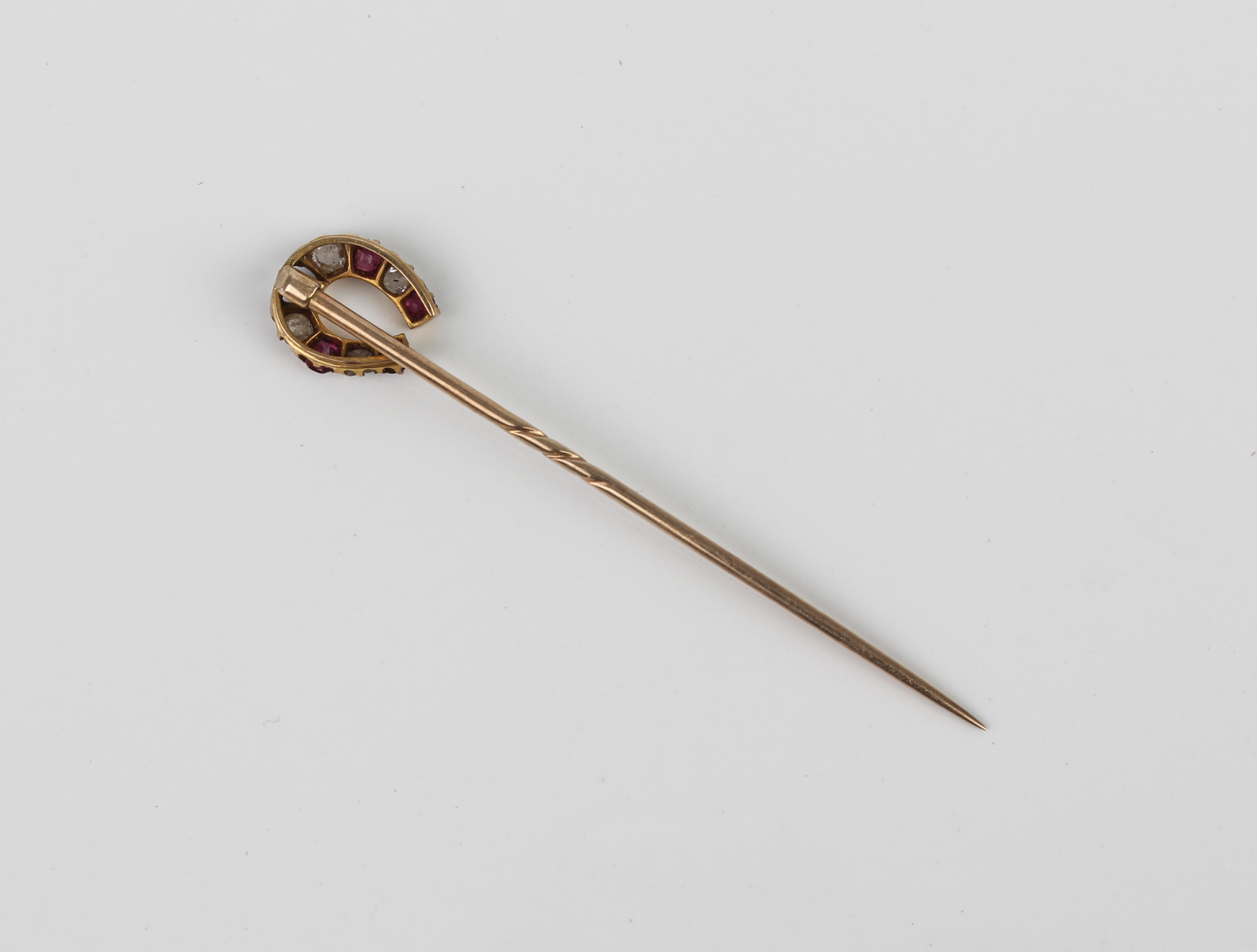 An antique 9ct yellow gold, ruby and diamond horseshoe stick pin - with rose gold pin, one ruby - Image 2 of 3