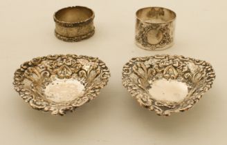 Two silver napkin rings and a pair of pin dishes (4)