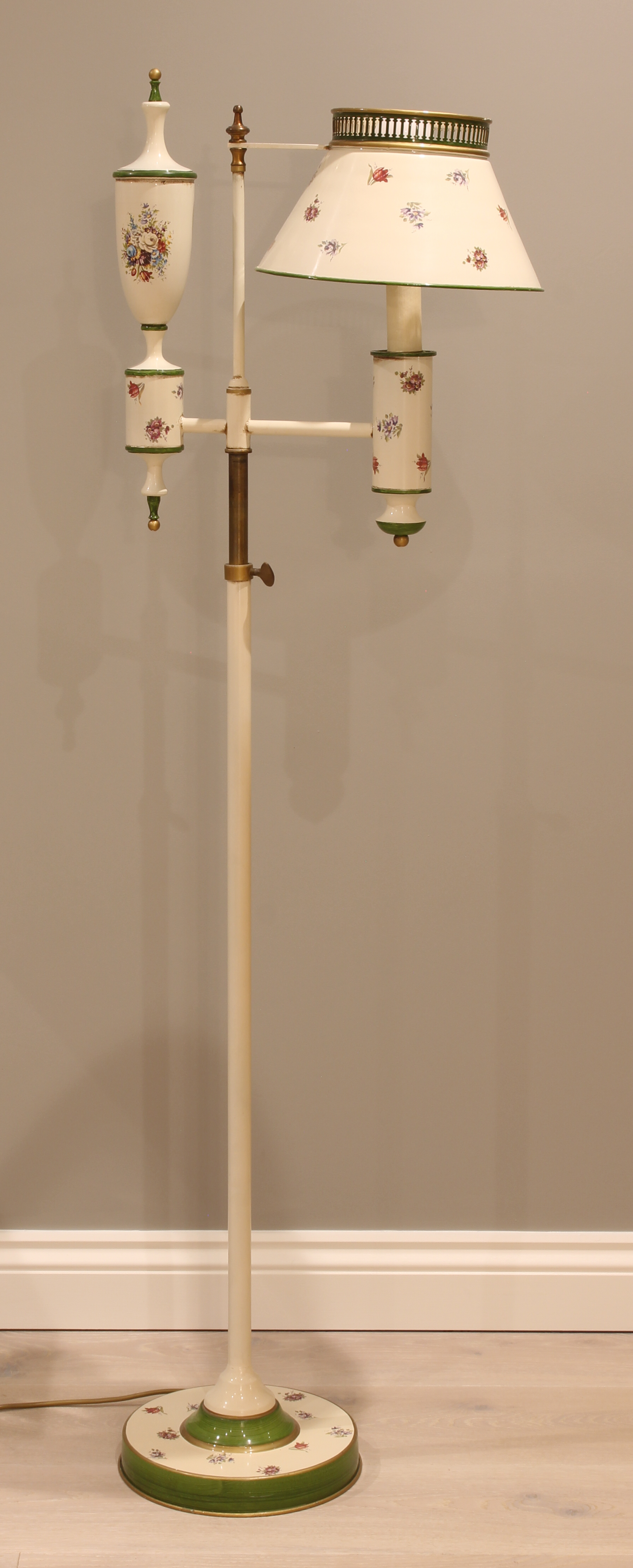 A 19th century style tole style painted metal adjustable standard lamp - in the style of an oil lamp