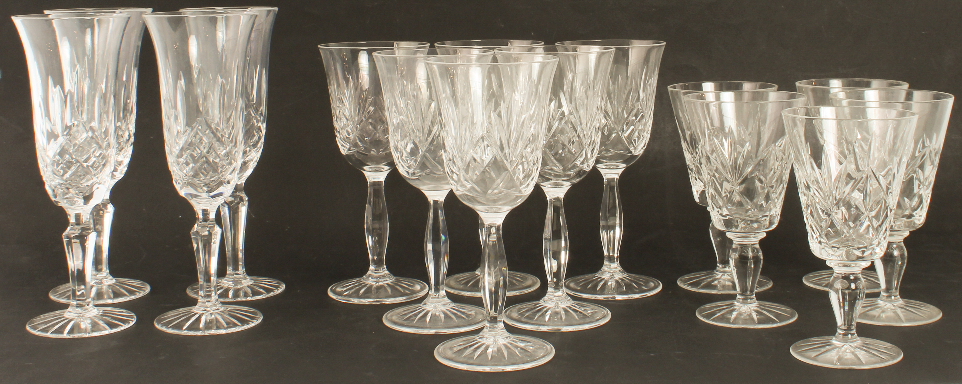 A part-set of cut-glass wine glasses with sunburst bases: 6 x 16.5 cm wines  6 x 13.5 cm wines 4 x