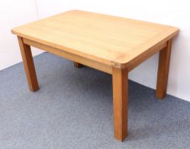 A modern light-oak kitchen dining table - the cleated, rectangular top with rounded angles, raised