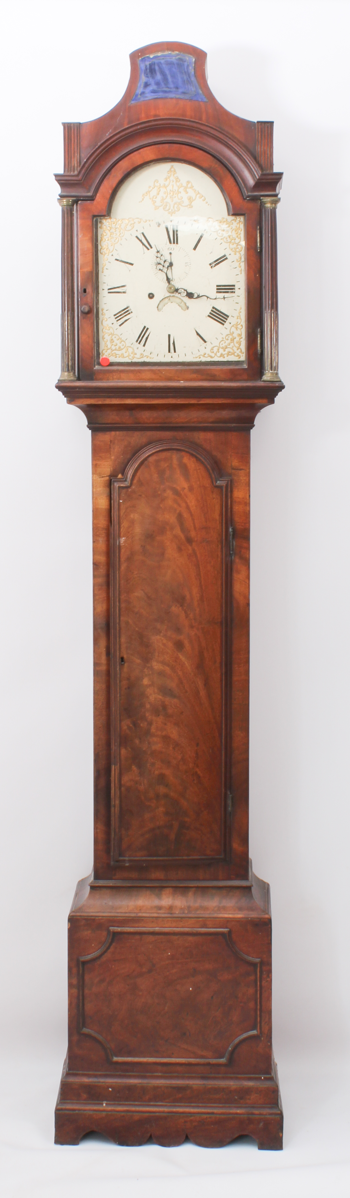 An early 19th century mahogany eight day longcase clock - the hood with caddy top with central