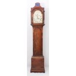 An early 19th century mahogany eight day longcase clock - the hood with caddy top with central