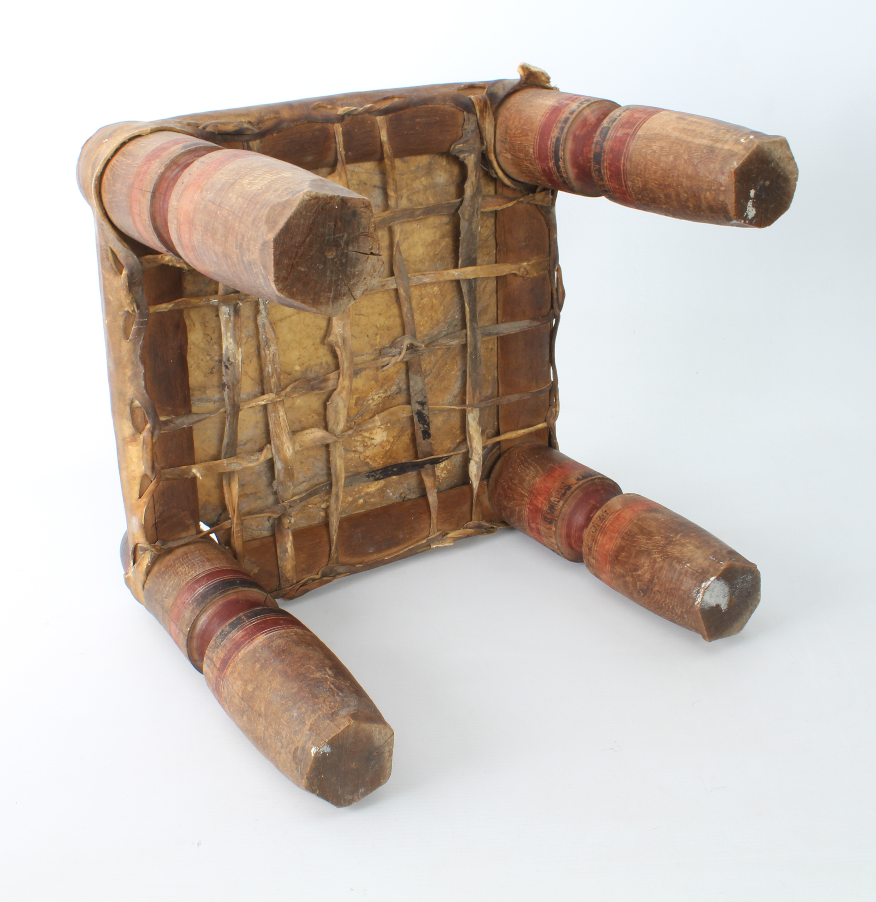 An Indian turned wooden and vellum stool - early to mid-20th century, square, the vellum seat - Image 2 of 4