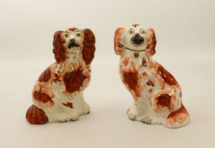 Two 19th century small Staffordshire pottery dogs - 19.2 cm high, one chipped to front paw.