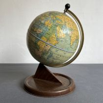 A 1950s Chad Valley tinplate childs or school globe - 27 cm high.