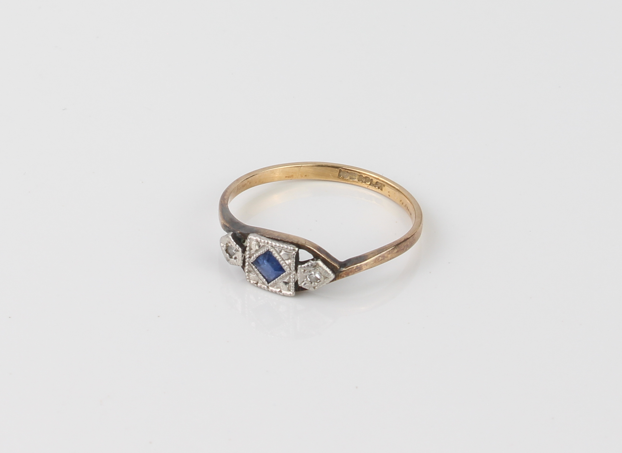 A 1920s 18ct yellow gold, platinum, sapphire and diamond three stone ring - stamped '18CT & PLAT',