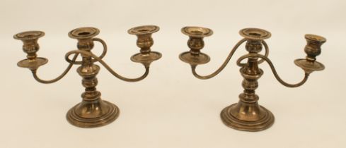 A pair of silver plate on copper two-branch candelabra - with reeded scroll arms, gadrooned