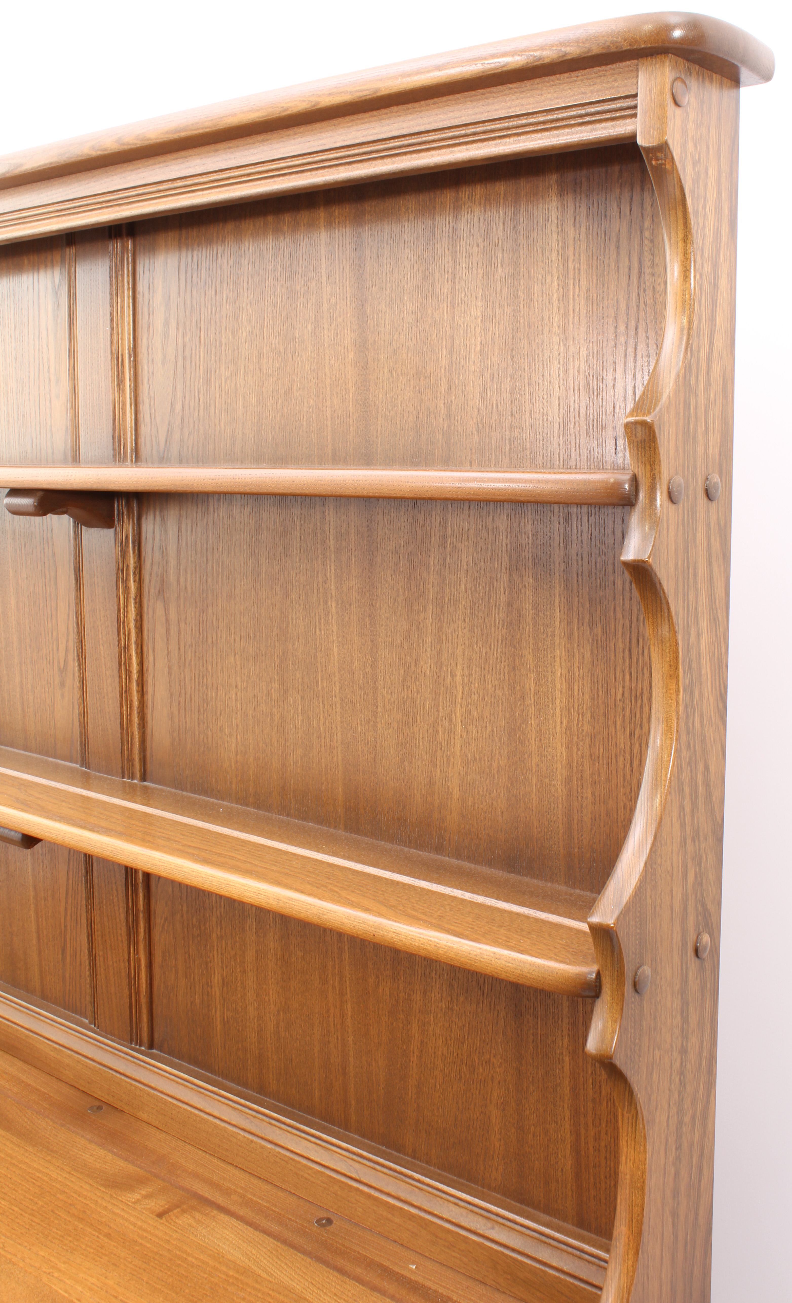 An Ercol Windsor elm dresser - the back with waterfall plate rack, over a base with two drawers (one - Image 3 of 8