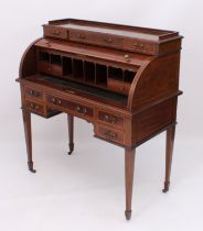 A good quality Edwardian satinwood-banded mahogany cylinder desk - the shallow top with three-