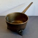 A bronze sauce pan