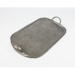 An Archibald Knox for Liberty & Co. 'Tudric' pewter tray - of rounded oblong form with planished