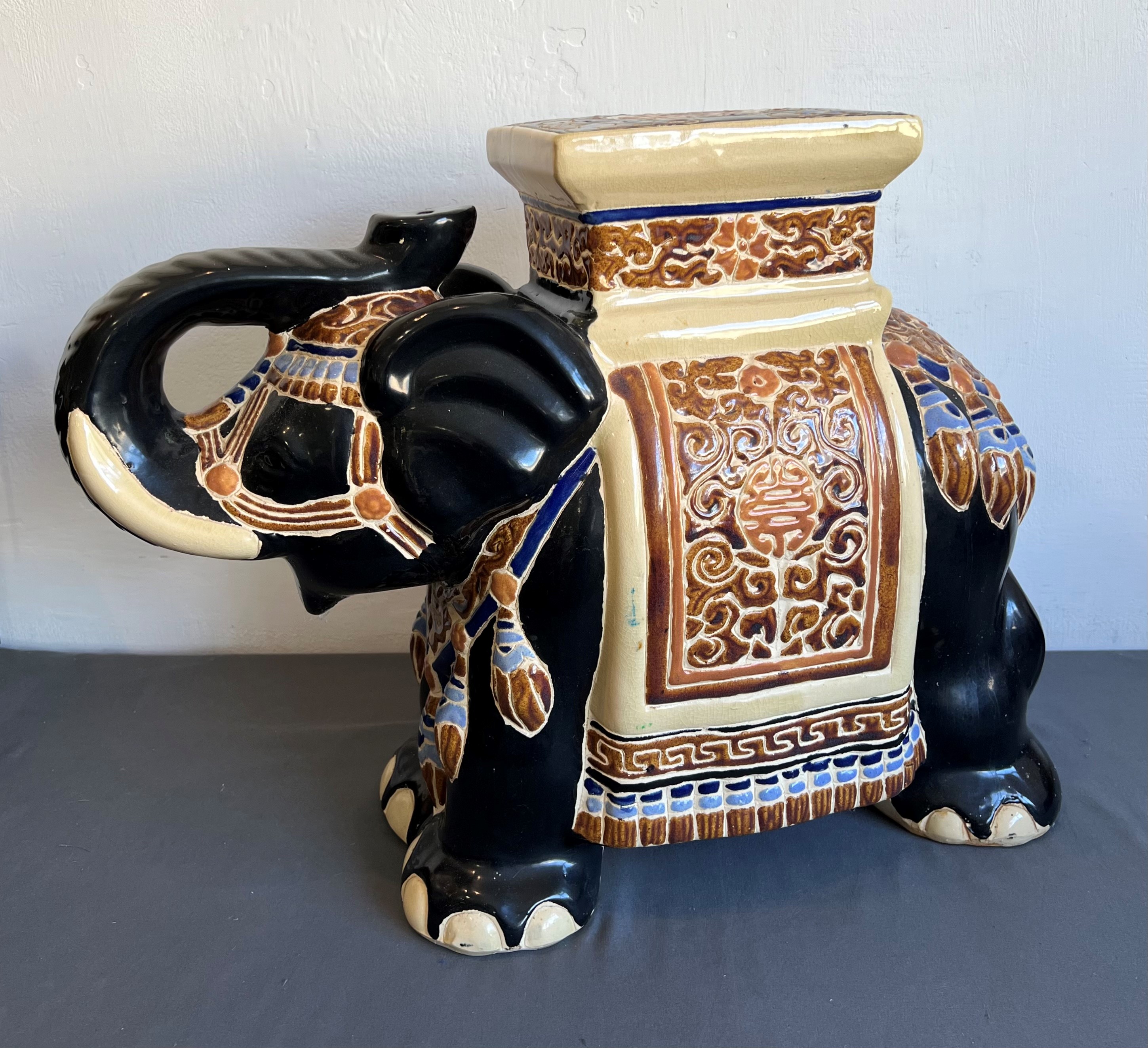 Three large pieces of Oriental pottery and porcelain - modern, comprising an earthenware elephant