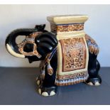 Three large pieces of Oriental pottery and porcelain - modern, comprising an earthenware elephant