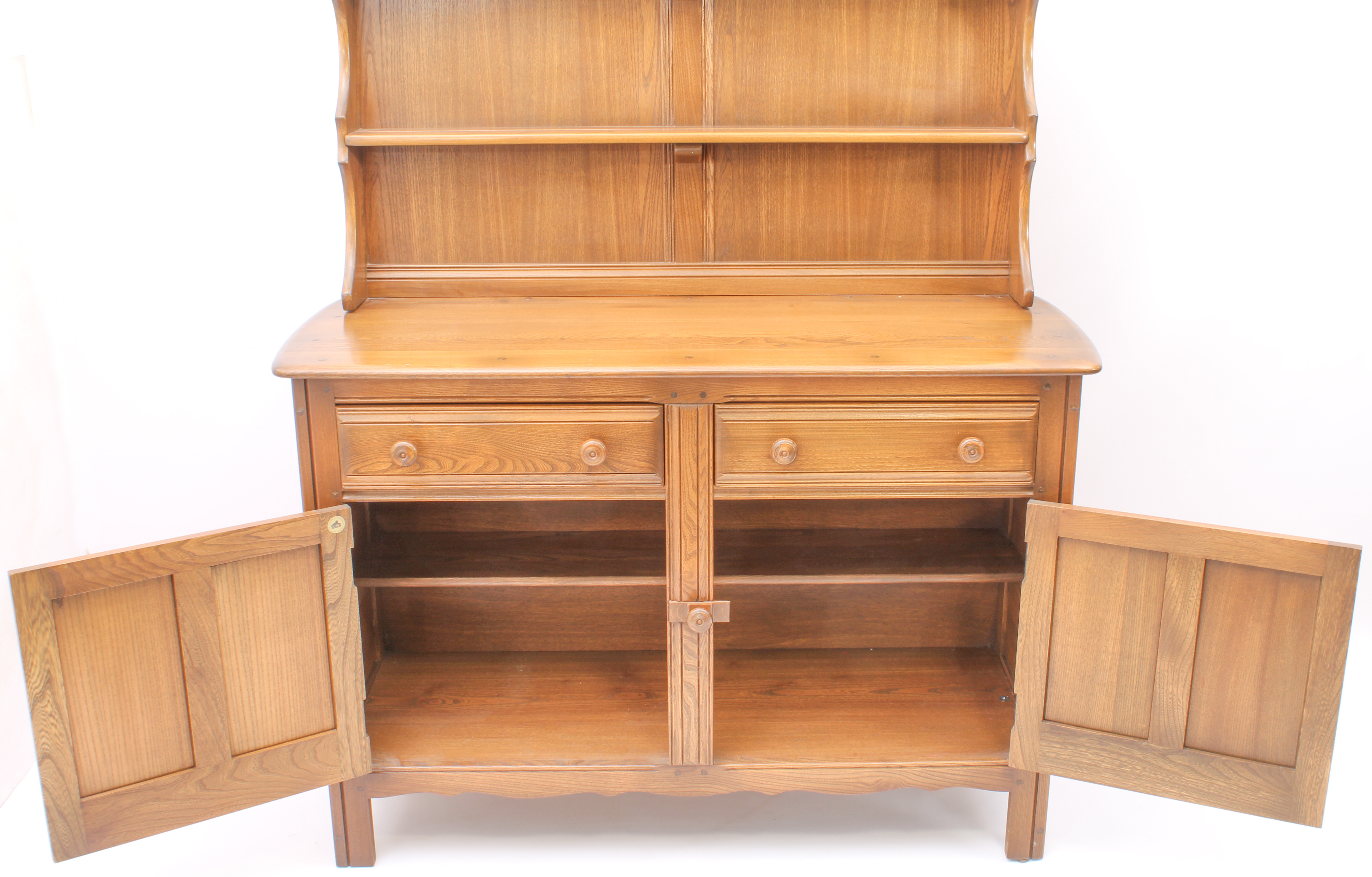 An Ercol Windsor elm dresser - the back with waterfall plate rack, over a base with two drawers (one - Image 6 of 8