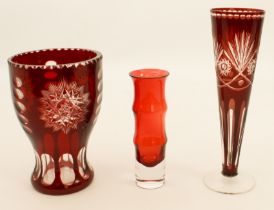 Three pieces of coloured glass - comprising a Bohemian ruby cased vase, 17.3 cm high; a Bohemian