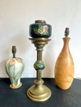 A Victorian brass and pottery oil lamp - the fluted column with foliate capital, to a flared