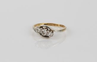 A 1950s-60s 18ct gold and diamond three stone twist or trilogy ring - hallmarked '18CT PLAT', with a