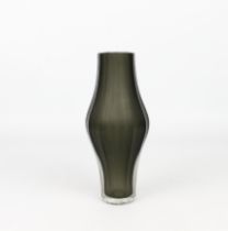 A modernist art glass vase - possibly Scandinavian, of slender, twelve-sided bellied form, in dark