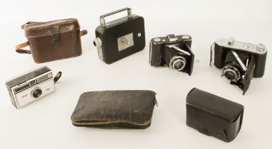 A Kodak Cine-Eight Model 25 8mm cine camera and three vintage cameras: an Ensign 220 Selfix, Zeiss