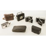 A Kodak Cine-Eight Model 25 8mm cine camera and three vintage cameras: an Ensign 220 Selfix, Zeiss