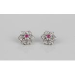 A pair of good quality 18ct white gold, ruby and diamond floral cluster earrings - unmarked, test as