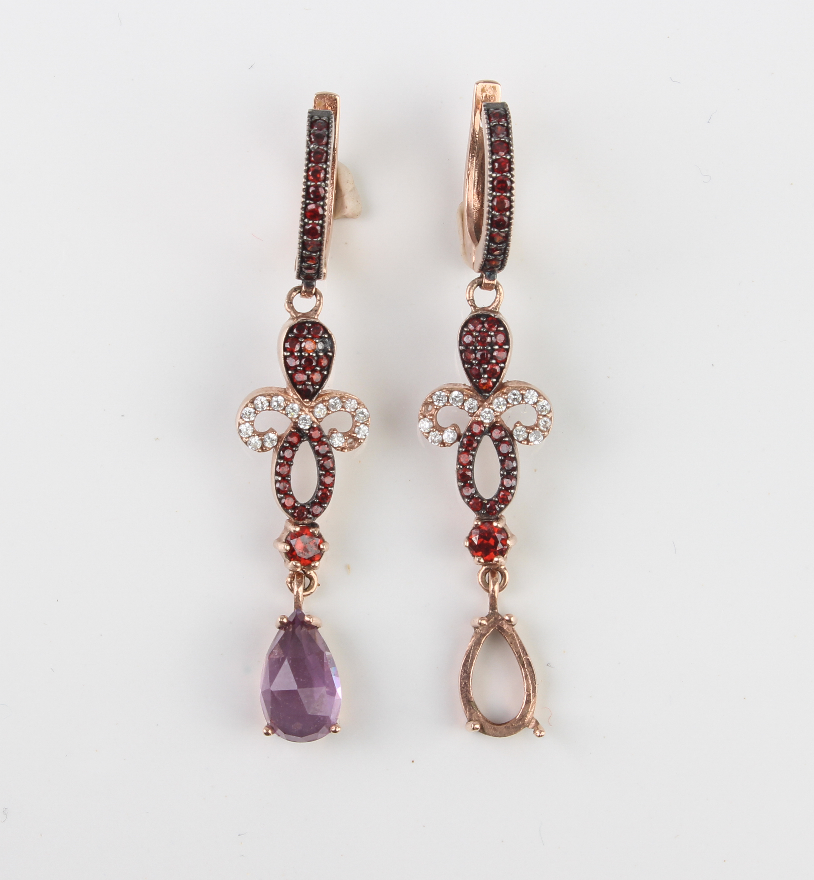 A pair of 8ct rose gold, white stone, amethyst and garnet drop earrings - marked '333', with post