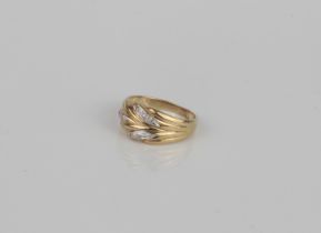 A 9ct gold and diamond ring - hallmarked Sheffield 1994, the foliate two-colour setting accented