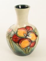 A Moorcroft vase in the 'Fresia' pattern - designed by William Moorcroft, impressed factory marks,