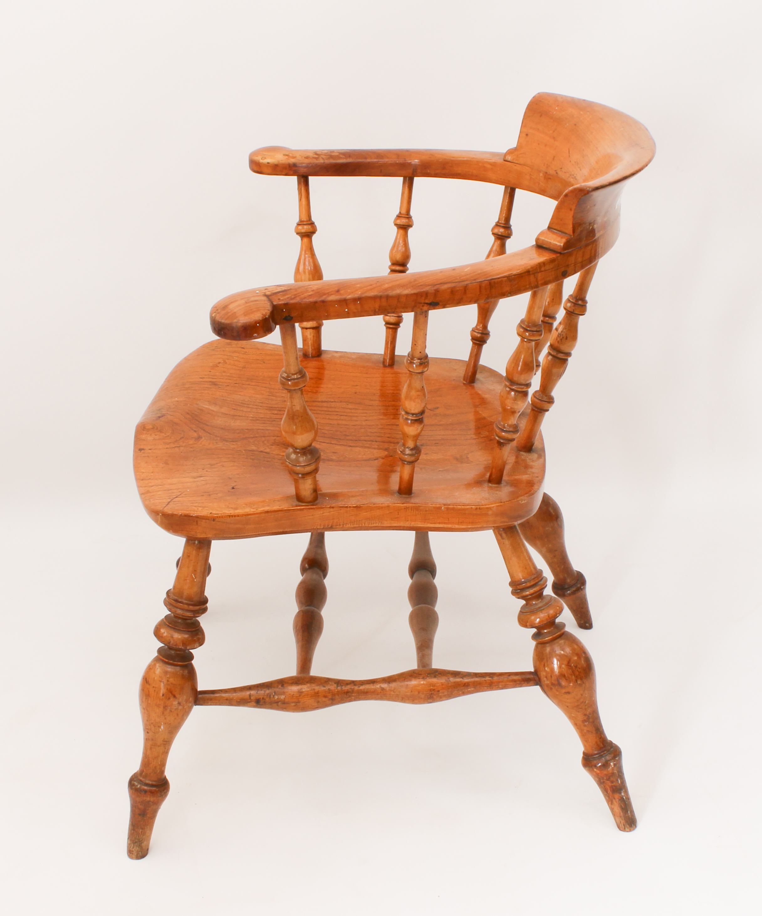 A late 19th century fruitwood and elm smoker's bow armchair - the horseshoe back with turned - Image 3 of 4