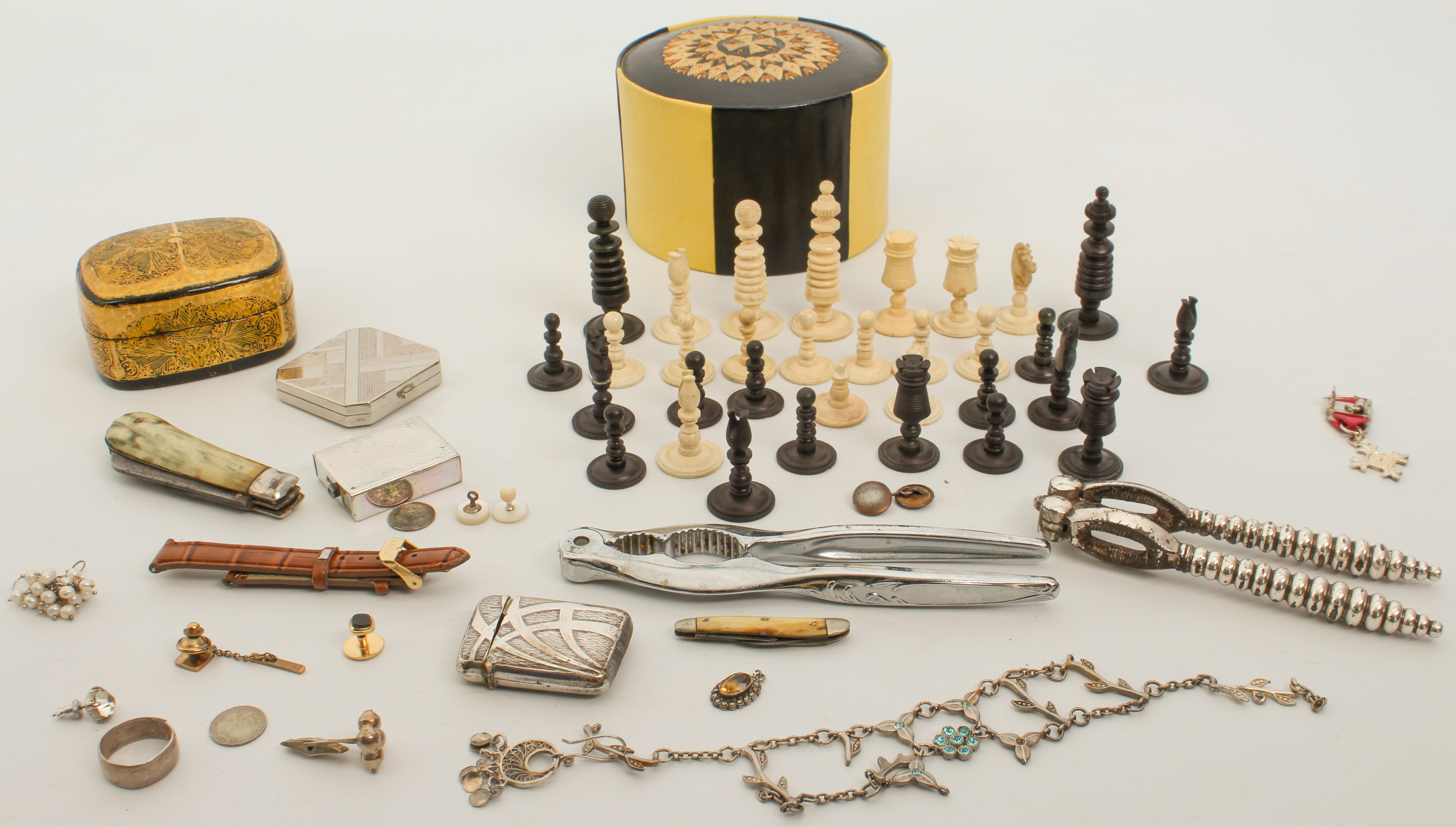 A mixed lot of miscellania to include a part chess set, jewellery, nutcrackers etc.