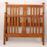 A mid-oak Arts & Crafts style double-bed frame - with steel bed frame, the slatted head and foot