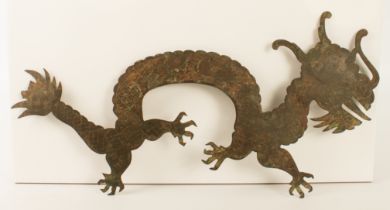 A Chinese bronze dragon plaque - probably 19th century, the long bodied, four-toed dragon with