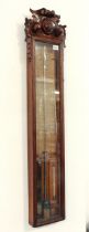 A late Victorian carved oak Admiral Fitzroy barometer by Field & Son of Birmingham - with red and