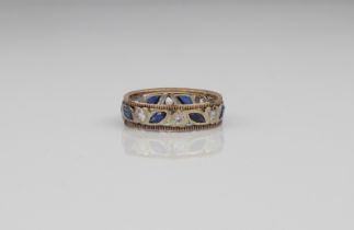 A 9ct gold two-colour sapphire eternity ring - London hallmarks, with alternate round cut white