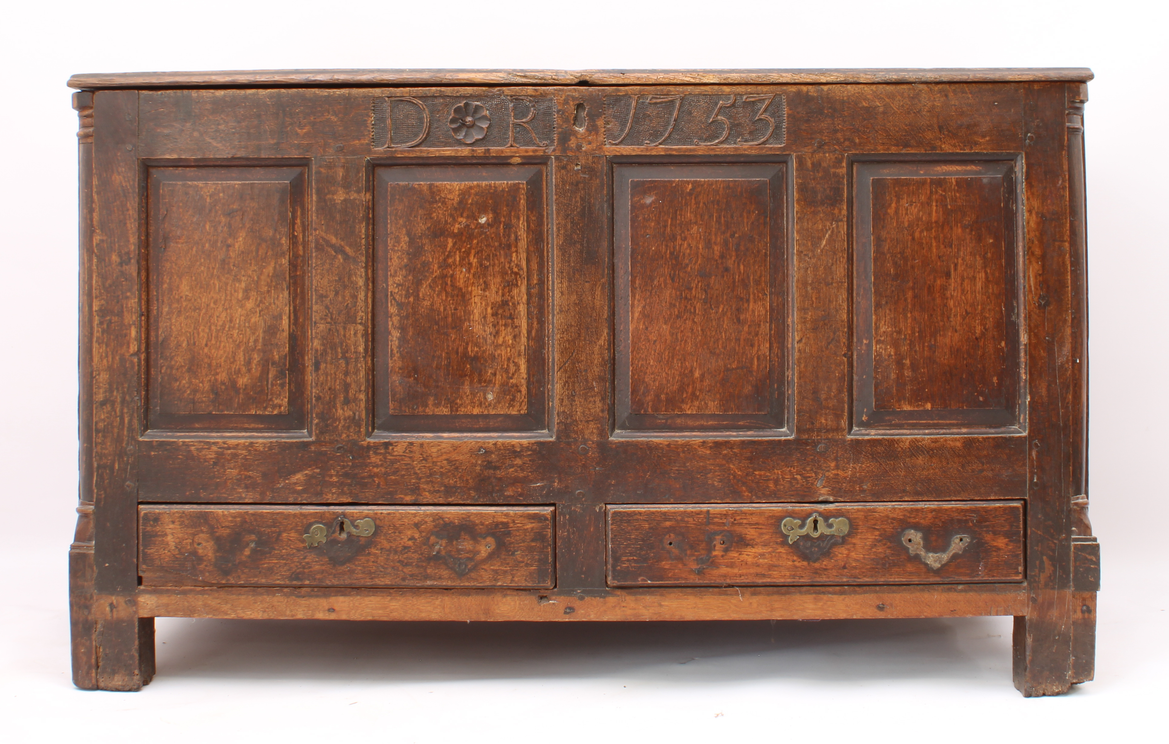 A George II oak mule chest - the boarded top with thumb-moulded front edge and iron strap-hinges,