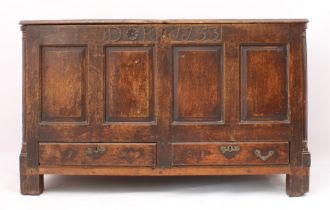 A George II oak mule chest - the boarded top with thumb-moulded front edge and iron strap-hinges,