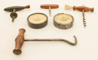 Two 19th century corkscrews - one with turned lignum vitae handle with brush and bronze stem, 12.8