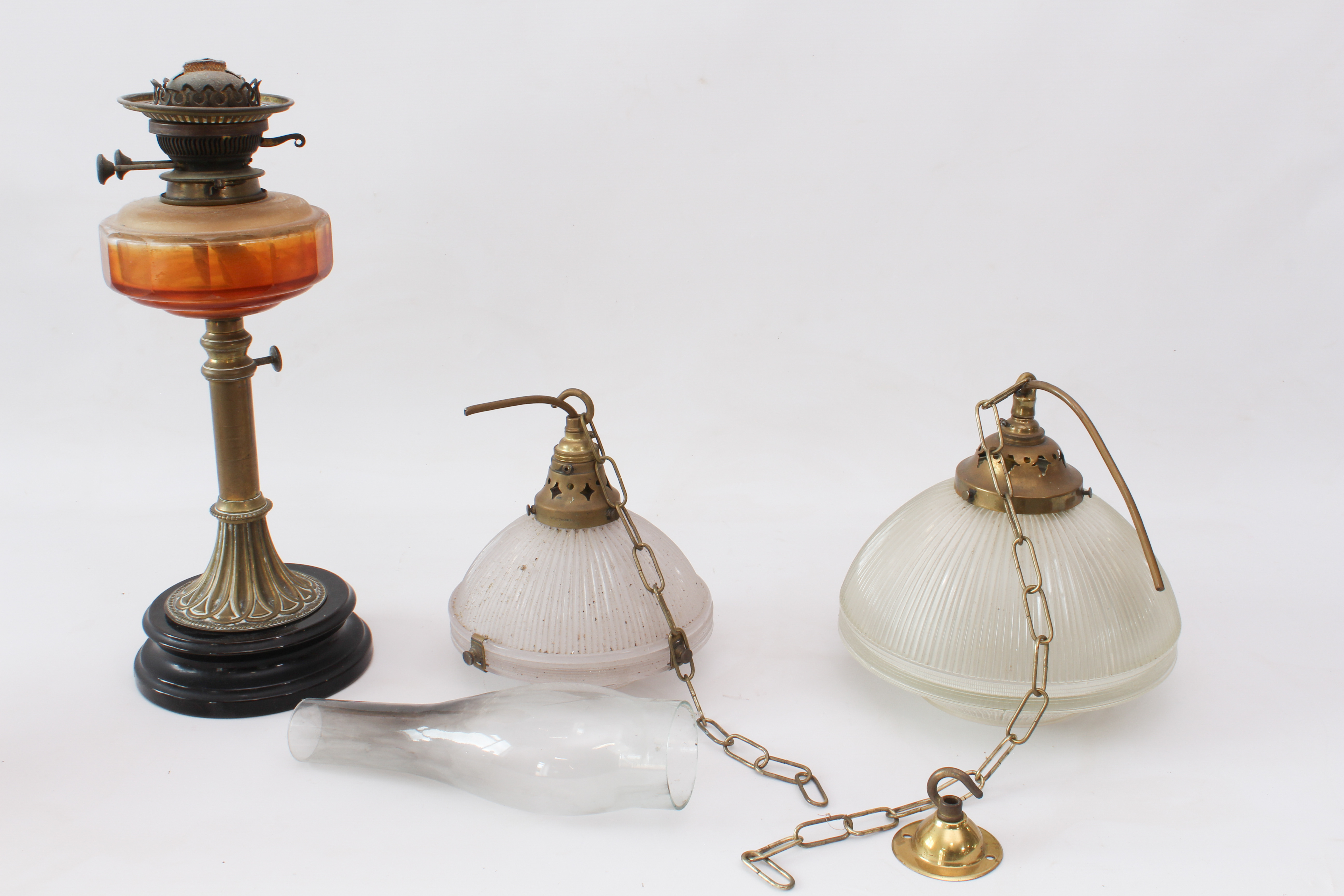 A graduated pair of glass and brass celling lights and an oil lamp - the ceiling lights with moulded