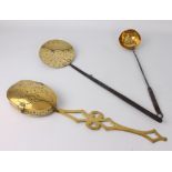 Three 19th century brass kitchen and fireside implements - comprising a brass chestnut roaster, with
