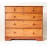 A Victorian pine chest of drawers - the moulded top over two short and three long graduated drawers,