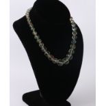 A vintage mid-century 'watermelon' bead necklace - 1930s-50s, the faceted, graduated clear glass