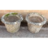 A pair of composite stone garden planters - well weathered, of tapering cylindrical form with