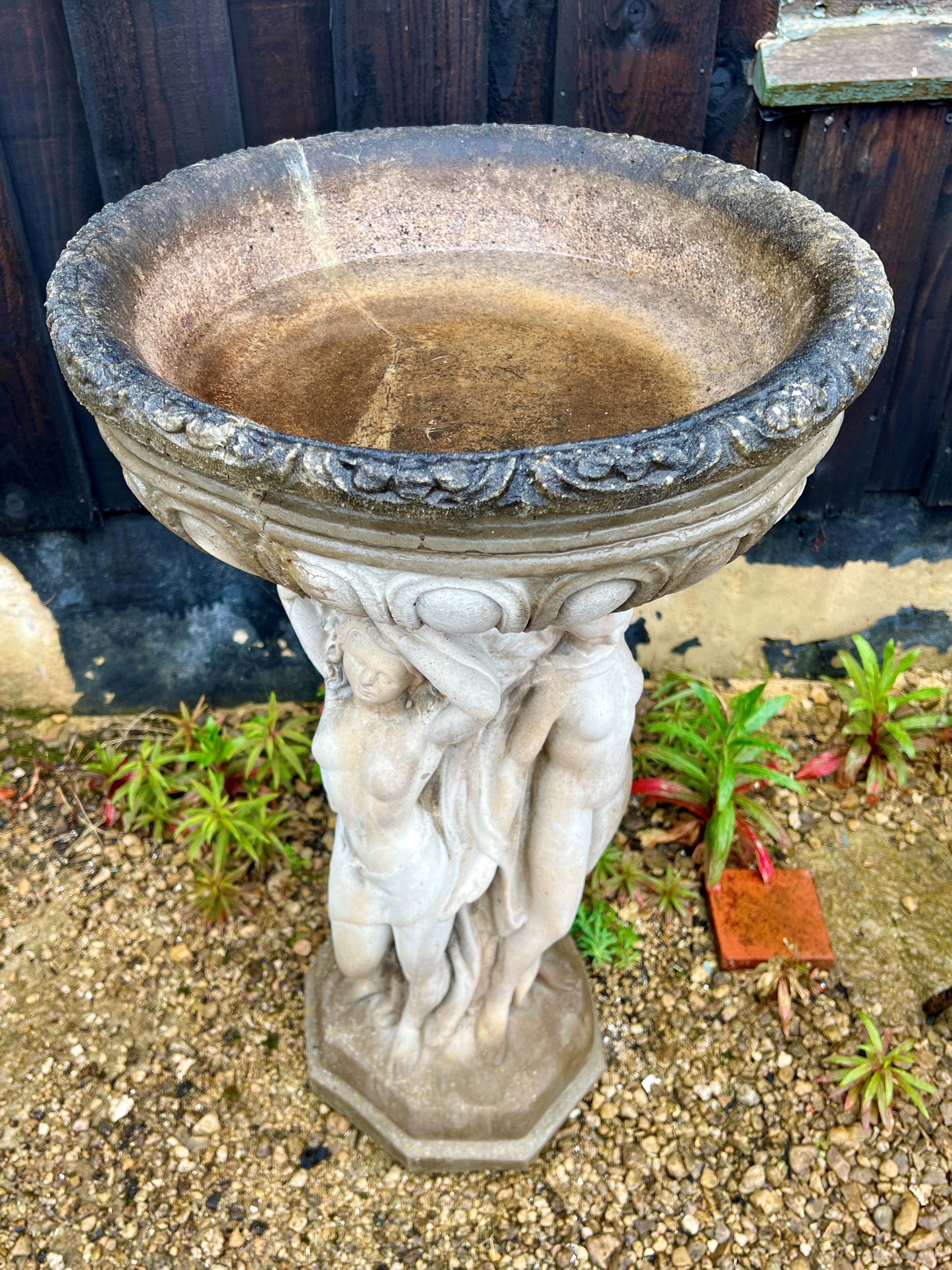 A composite stone bird bath - raised on a three graces style pedestal base, the bowl 46cm - Image 2 of 3