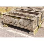 A pair of large rectangular composite stone troughs or planters - well weathered, decorated with