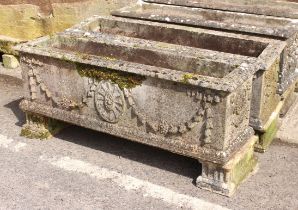 A pair of large rectangular composite stone troughs or planters - well weathered, decorated with