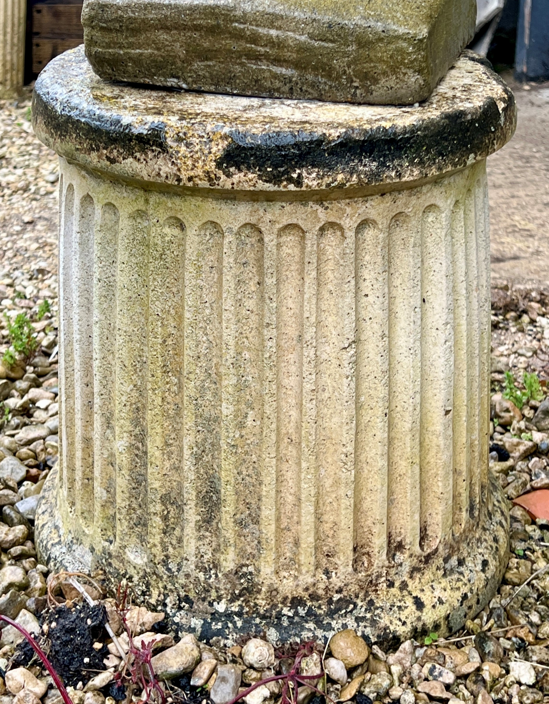 A pair of fluted column style planter bases or pedestals - (minor surface chip to both), 35cm